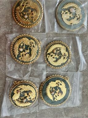 JADE- Gold-Tone Dragon Medallion Pendants on Dark Green Background
